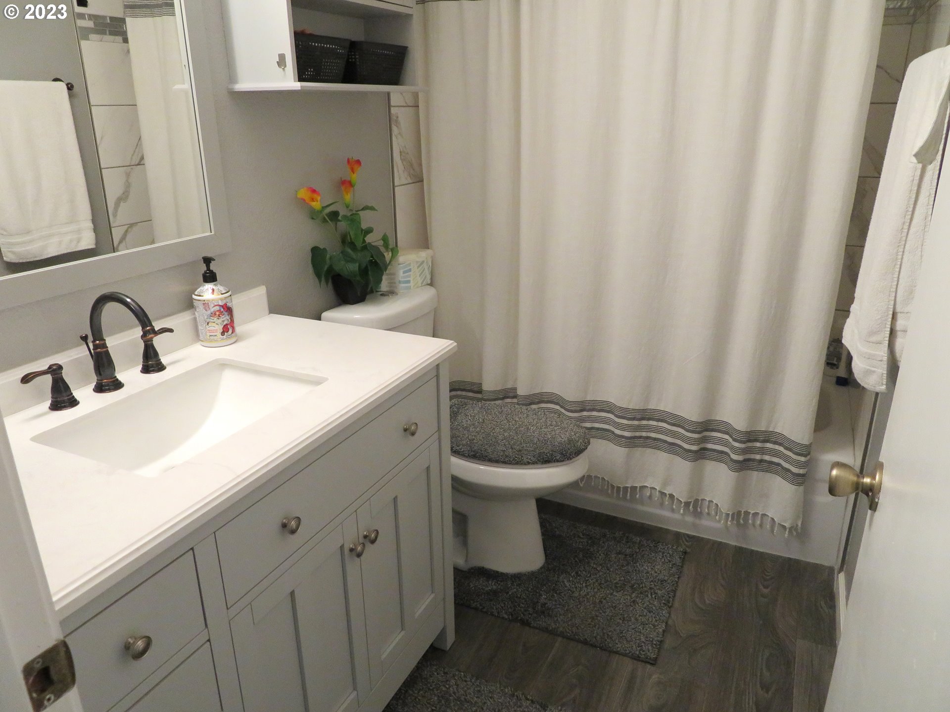 4440 Southwest 194th Court Beaverton, OR 97078 - Photo 20 of 32 a bathroom with a sink a toilet and a mirror