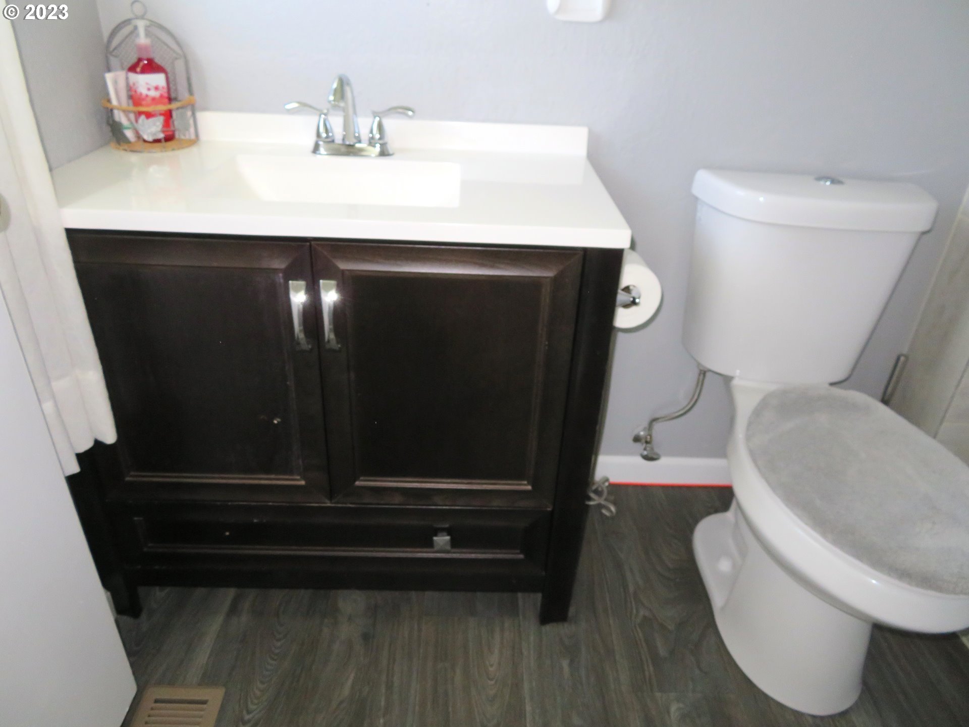 4440 Southwest 194th Court Beaverton, OR 97078 - Photo 23 of 32 a bathroom with a sink a toilet and a vanity