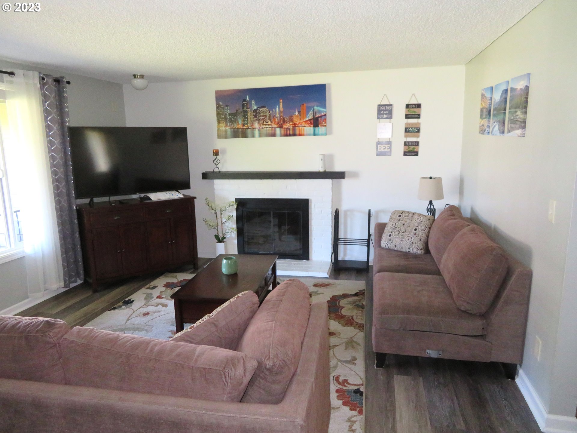 4440 Southwest 194th Court Beaverton, OR 97078 - Photo 6 of 32 a living room with furniture and a flat screen tv
