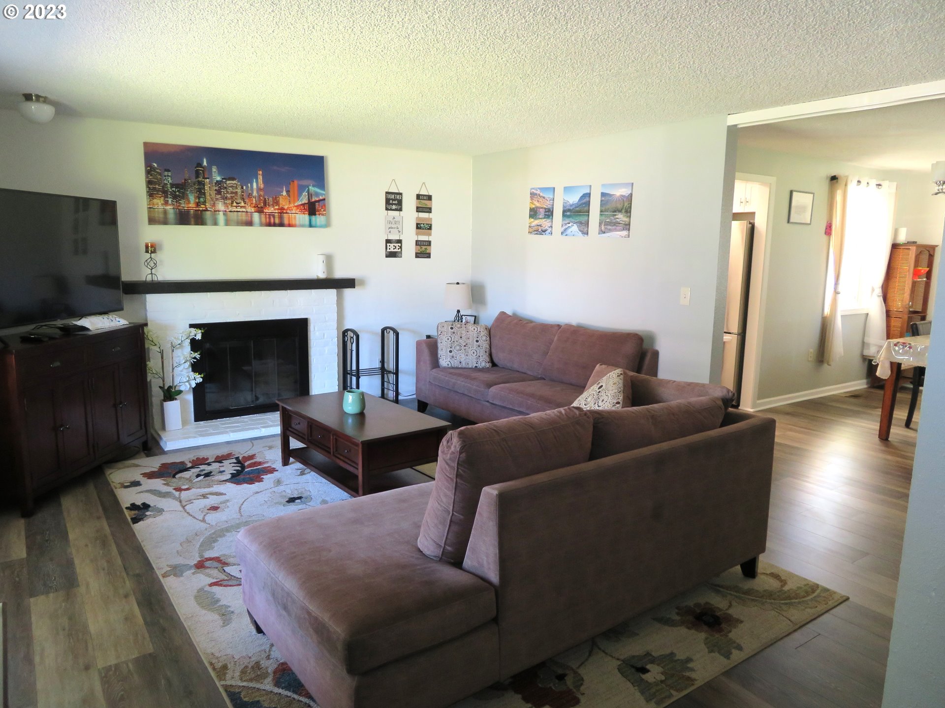4440 Southwest 194th Court Beaverton, OR 97078 - Photo 7 of 32 a living room with furniture and a fireplace