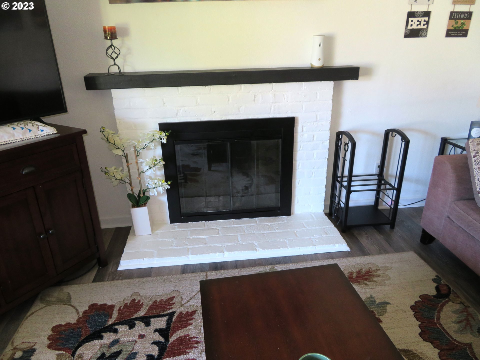 4440 Southwest 194th Court Beaverton, OR 97078 - Photo 8 of 32 a living room with furniture and a fireplace