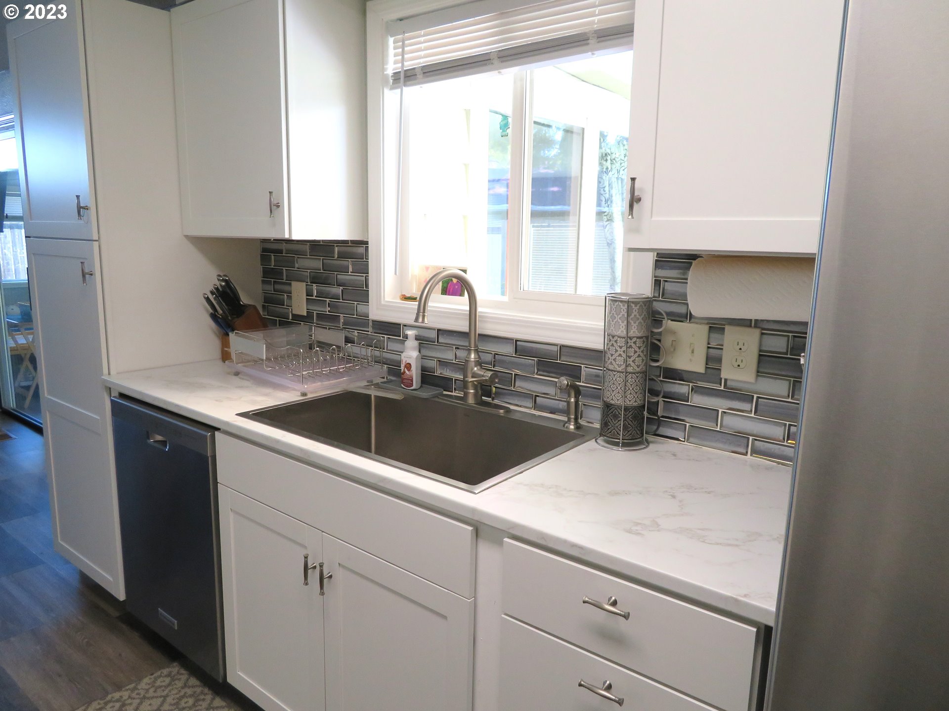 4440 Southwest 194th Court Beaverton, OR 97078 - Photo 9 of 32 a kitchen with a sink and a window