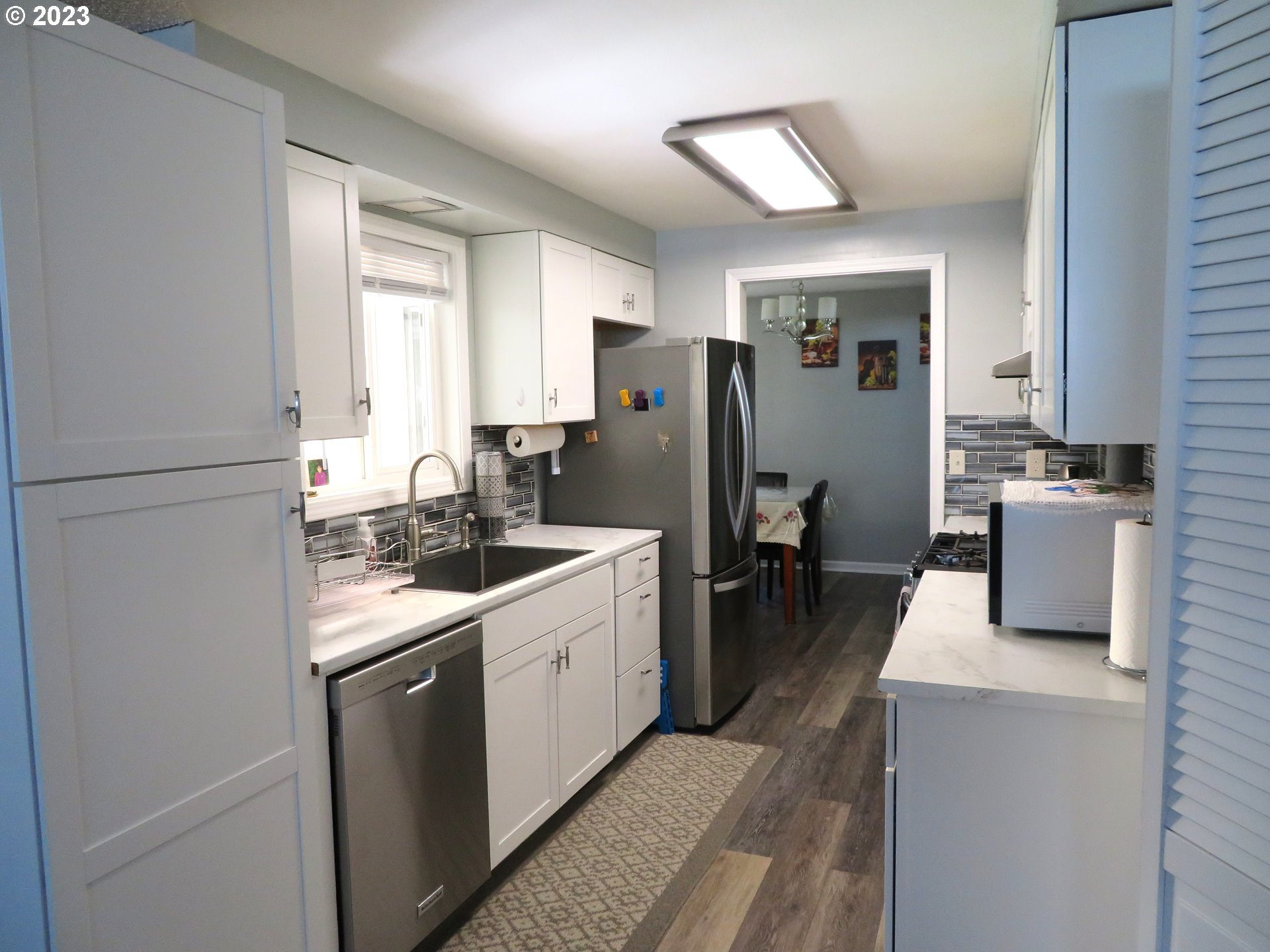 4440 Southwest 194th Court Beaverton, OR 97078 - Photo 10 of 32 a kitchen with a sink stove and refrigerator