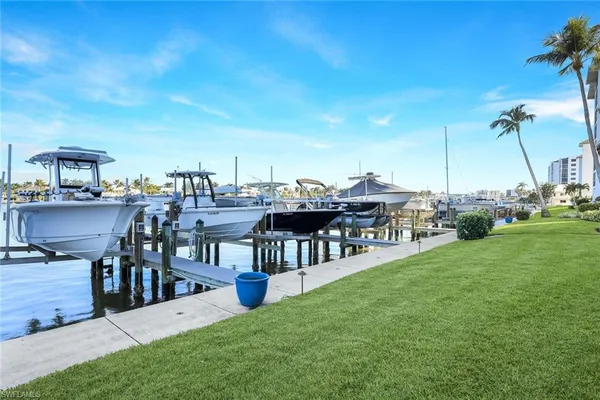 a view of a house with a backyard porch and sitting area