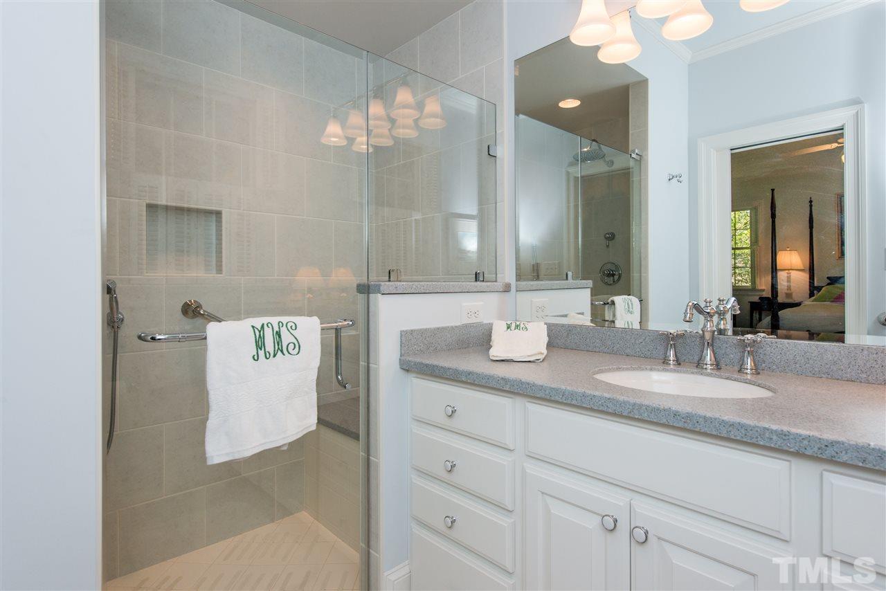 2503 Wake Drive Raleigh, NC 27608 - Photo 12 of 24 a bathroom with a granite countertop sink and a mirror