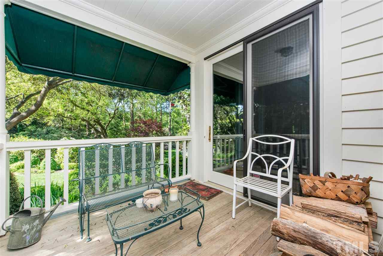 2503 Wake Drive Raleigh, NC 27608 - Photo 16 of 24 a balcony with furniture and a potted plant