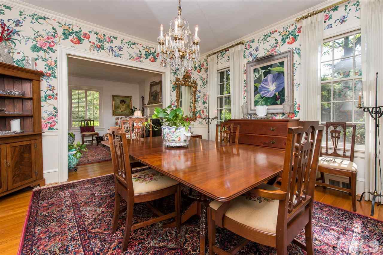 2503 Wake Drive Raleigh, NC 27608 - Photo 6 of 24 a view of a dining room with furniture window and wooden floor