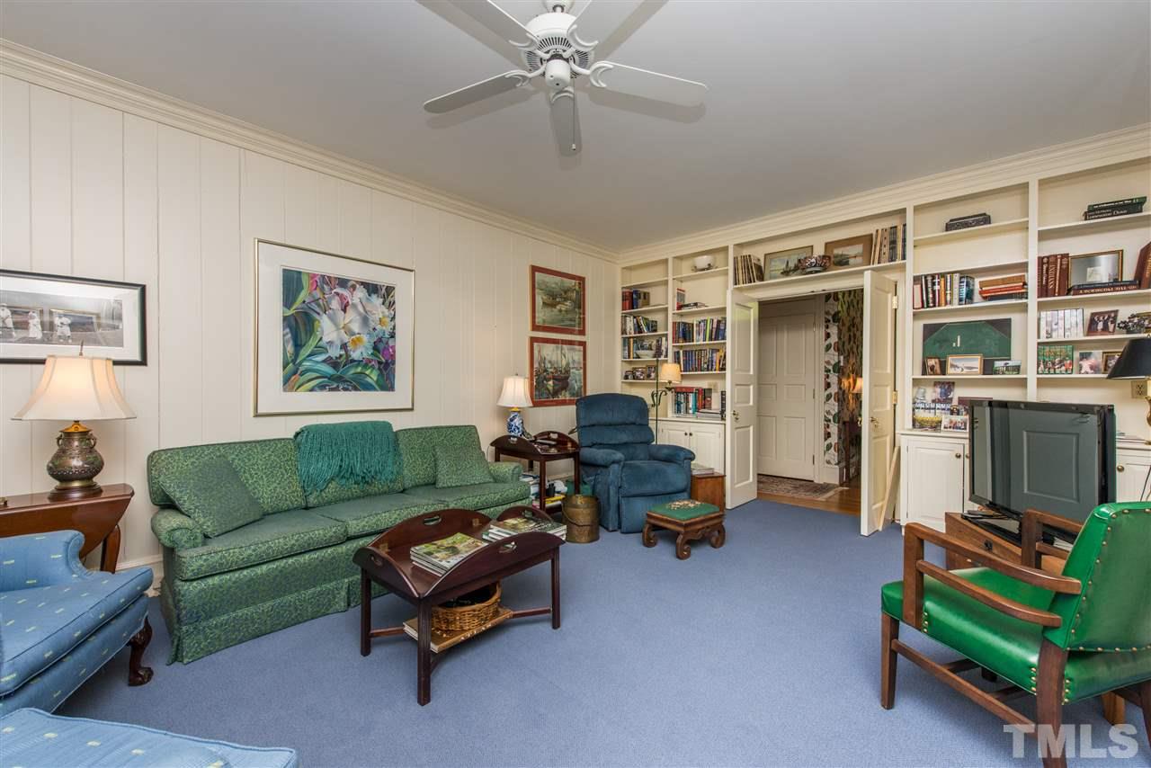 2503 Wake Drive Raleigh, NC 27608 - Photo 8 of 24 a living room with furniture and a gym equipment