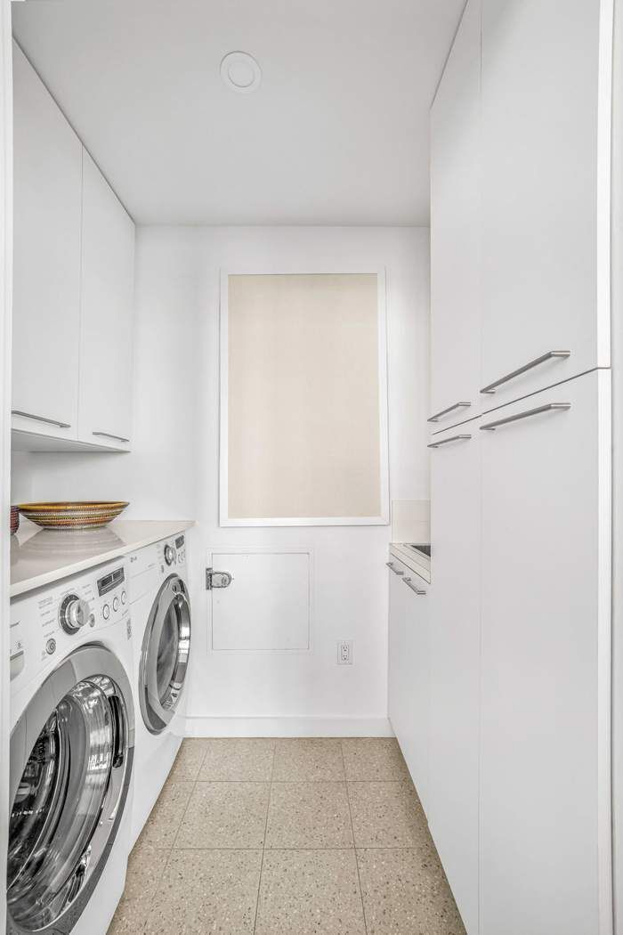 11 West 30th Street, Unit 14 Manhattan, NY 10001 - Photo 16 of 18 a view of bathroom with washer and dryer