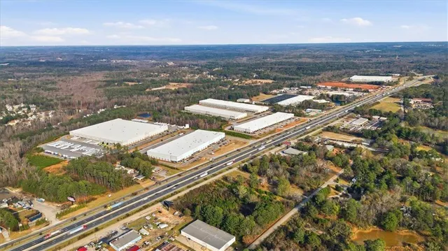 an aerial view of residential houses with outdoor space