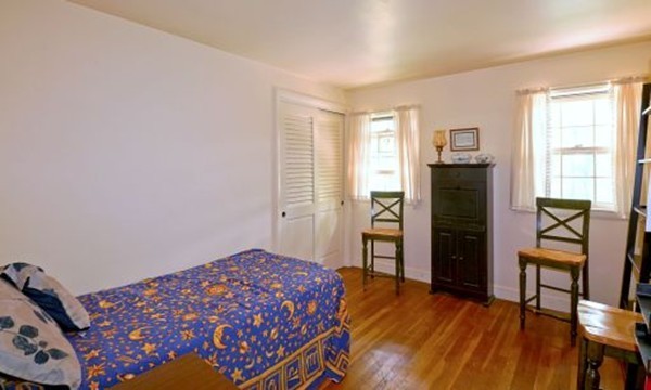 12 3 Ponds Road Wayland, MA 01778 - Photo 24 of 26 a bedroom with a bed and wooden floor