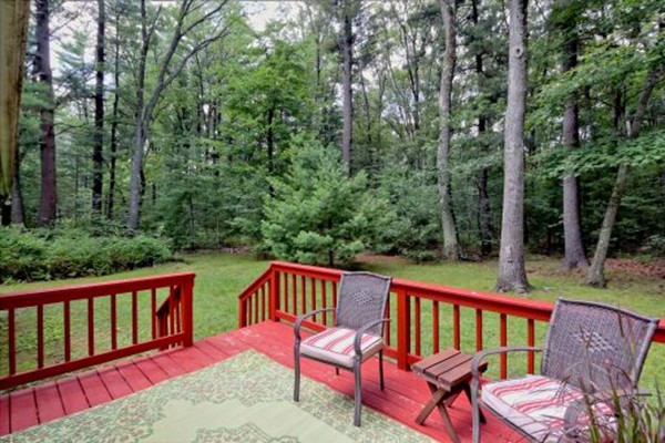 12 3 Ponds Road Wayland, MA 01778 - Photo 8 of 26 a view of a two chairs on the deck
