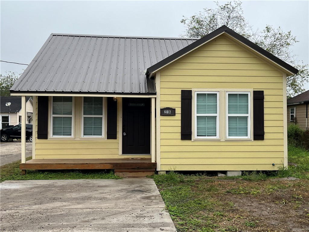 216 Hugh Street Sinton, TX 78387 - Photo 1 of 20 a view of a house with a yard