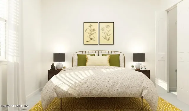 a kitchen with stainless steel appliances white cabinets and a refrigerator