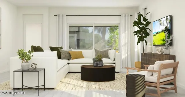 a living room with furniture and a large window with garden view