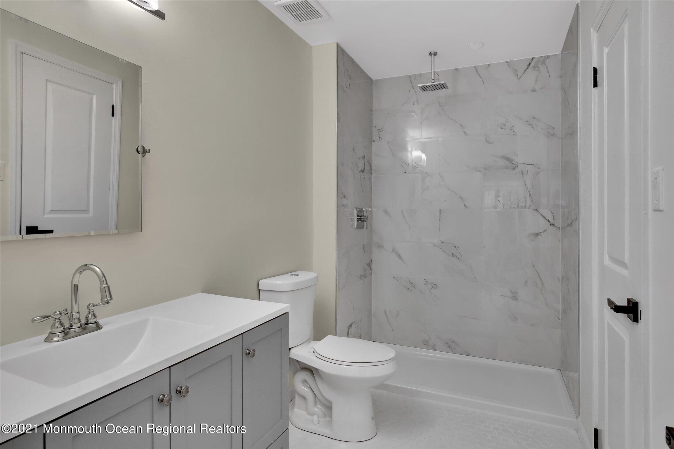 50 Wyckham Road Spring Lake Heights, NJ 07762 - Photo 16 of 27 a bathroom with a sink toilet and shower