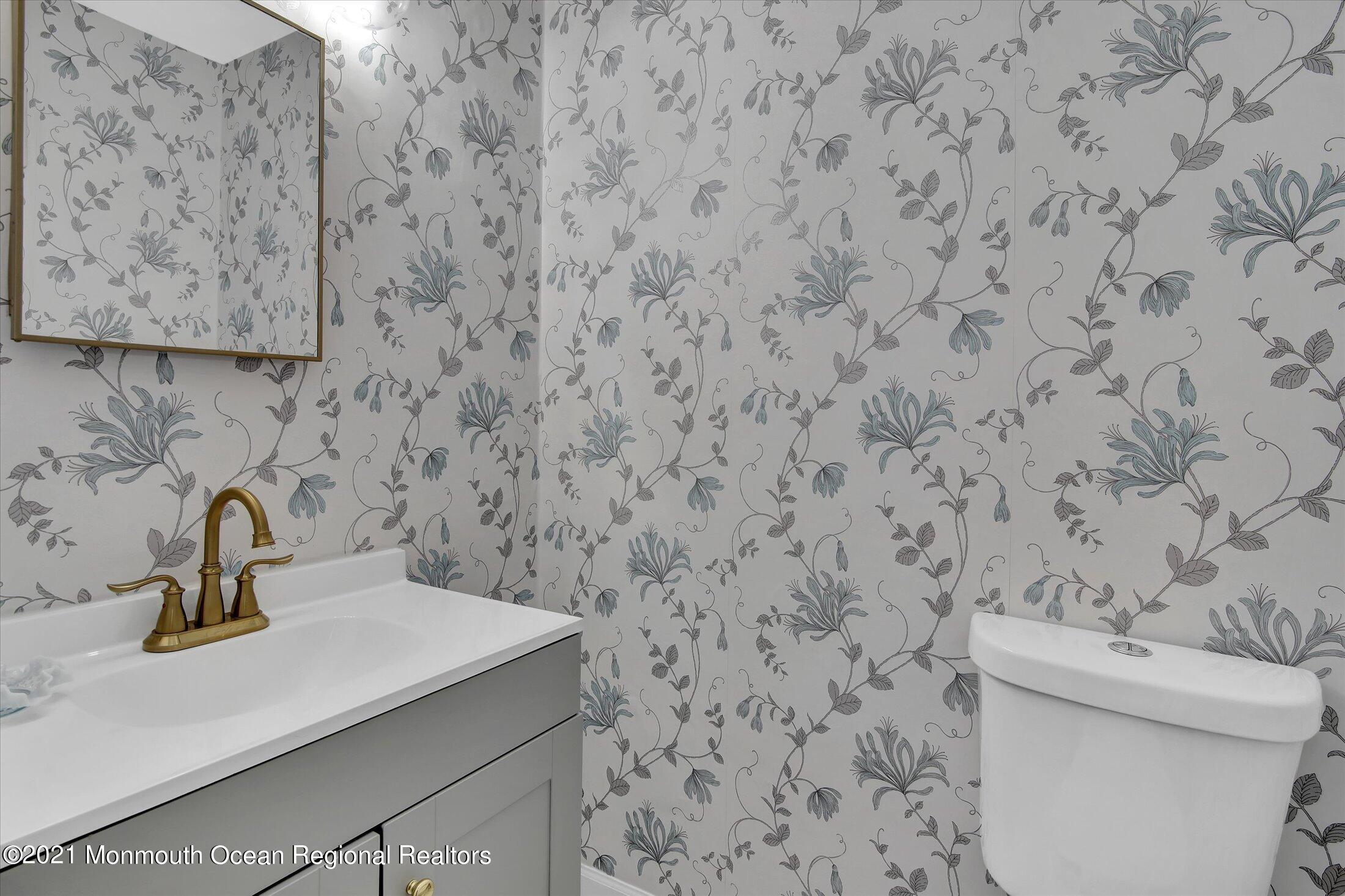 50 Wyckham Road Spring Lake Heights, NJ 07762 - Photo 19 of 27 a bathroom with a sink and a toilet