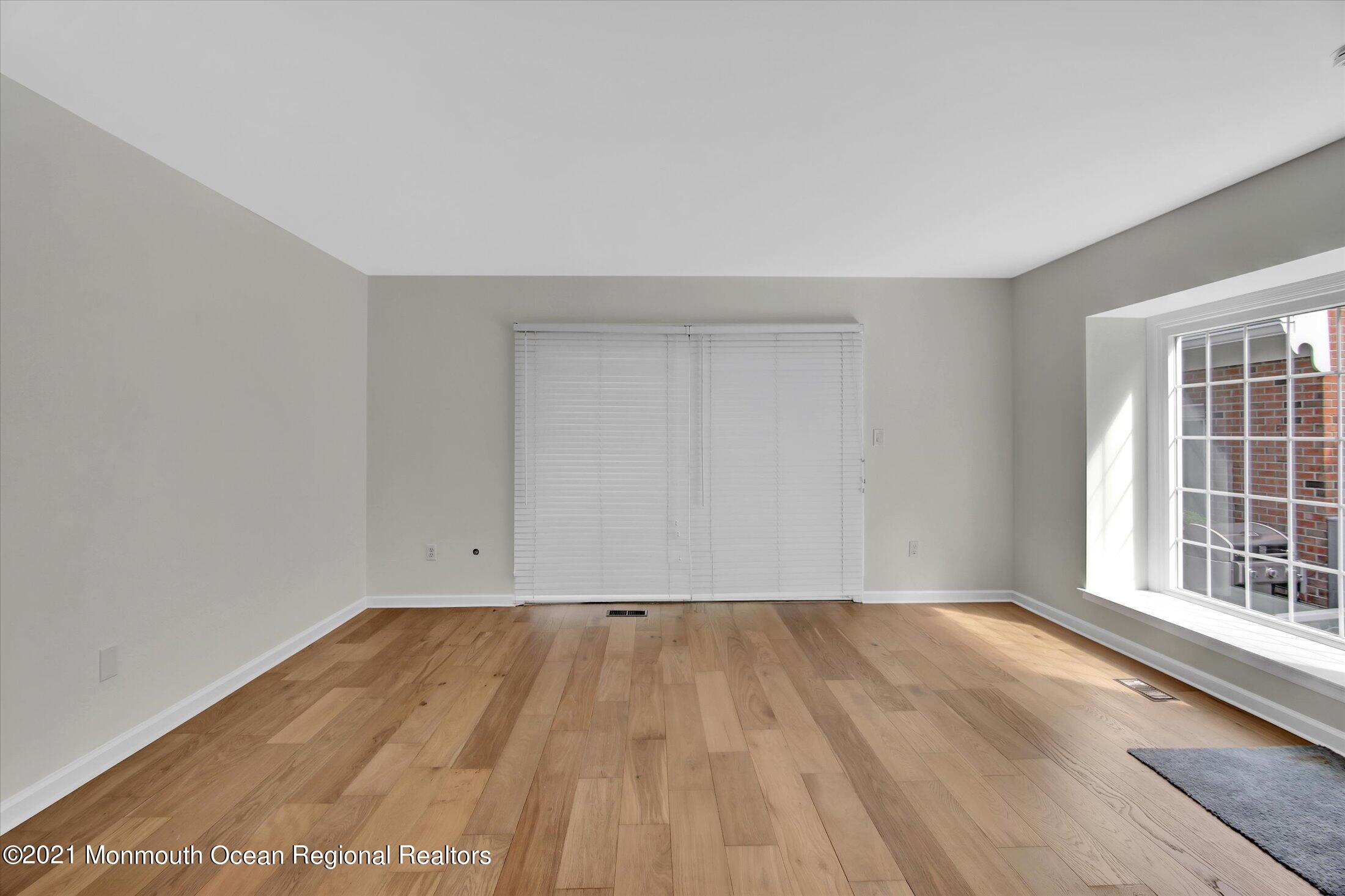 50 Wyckham Road Spring Lake Heights, NJ 07762 - Photo 7 of 27 wooden floor in a room