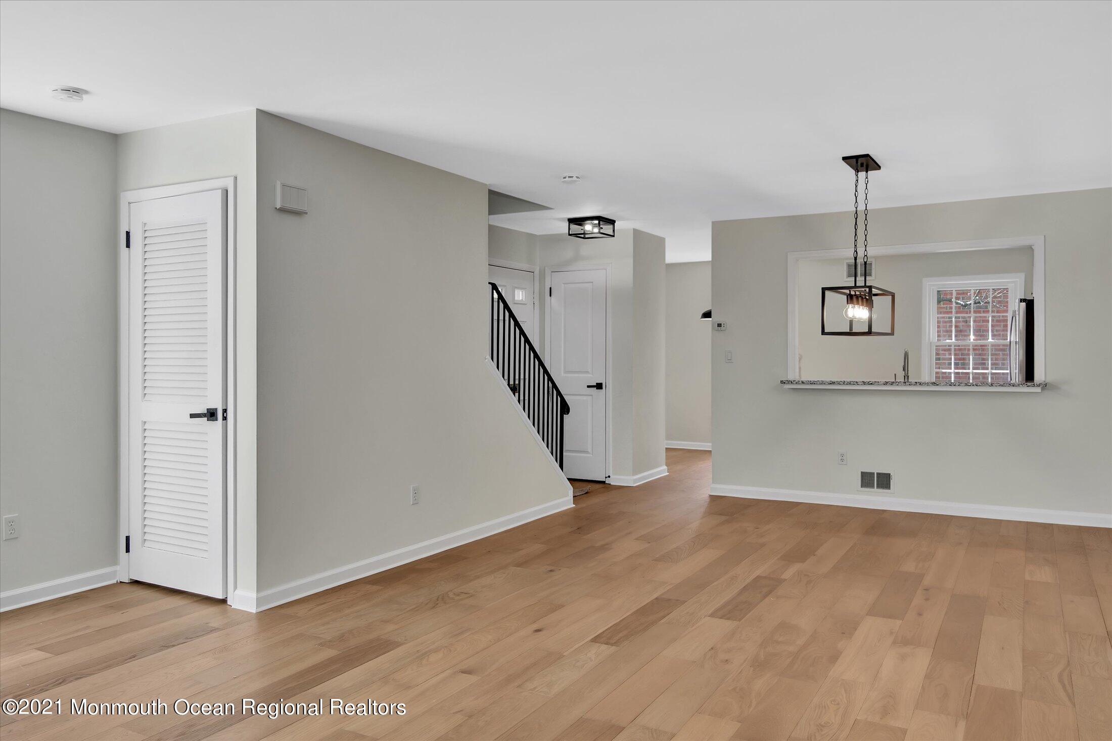 50 Wyckham Road Spring Lake Heights, NJ 07762 - Photo 9 of 27 a view of a room with wooden floor and staircase