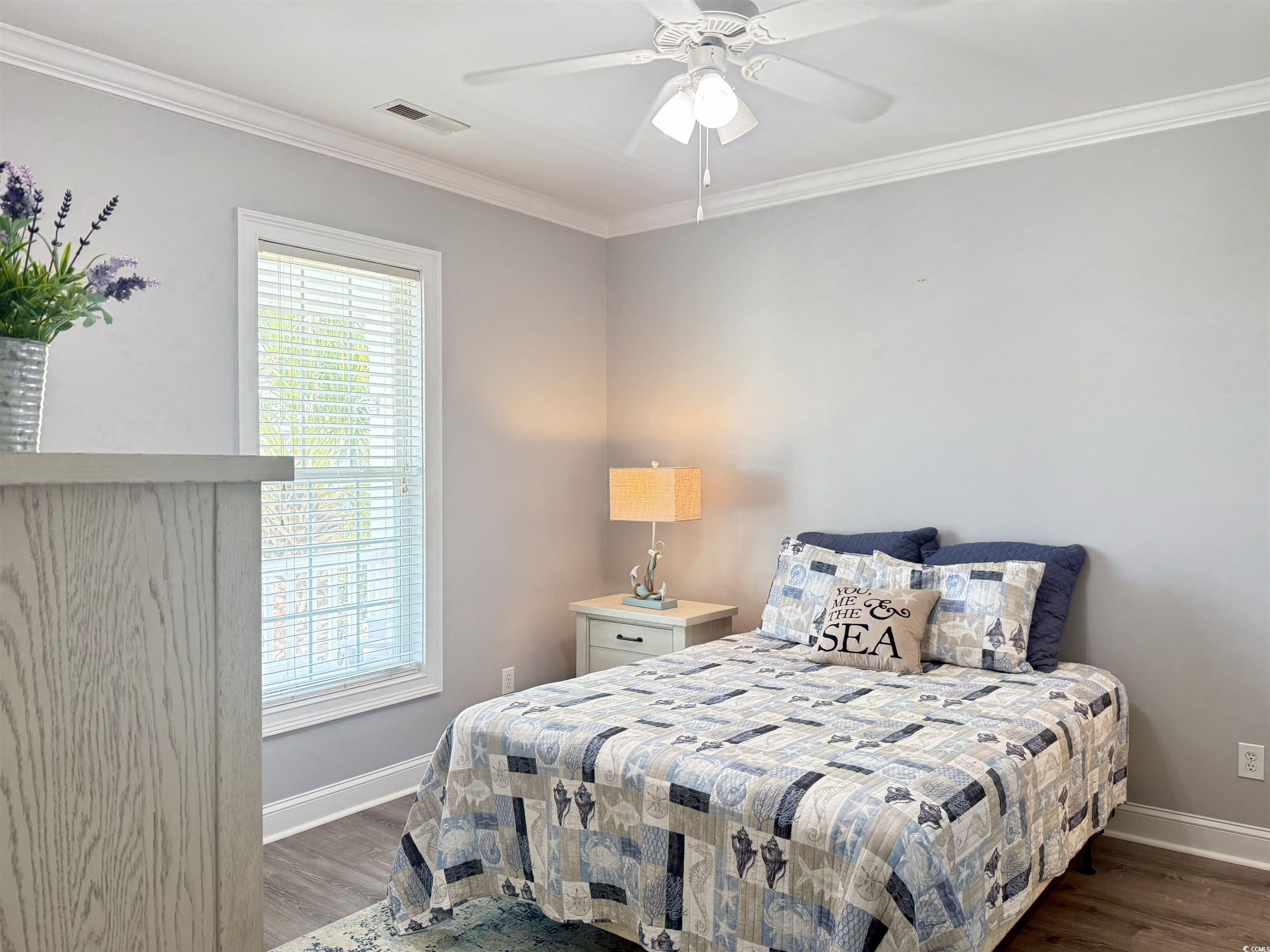 118 Georges Bay Road Murrells Inlet, SC 29576 - Photo 14 of 39 Bedroom featuring crown molding, dark wood-style floors, and a ceiling fan