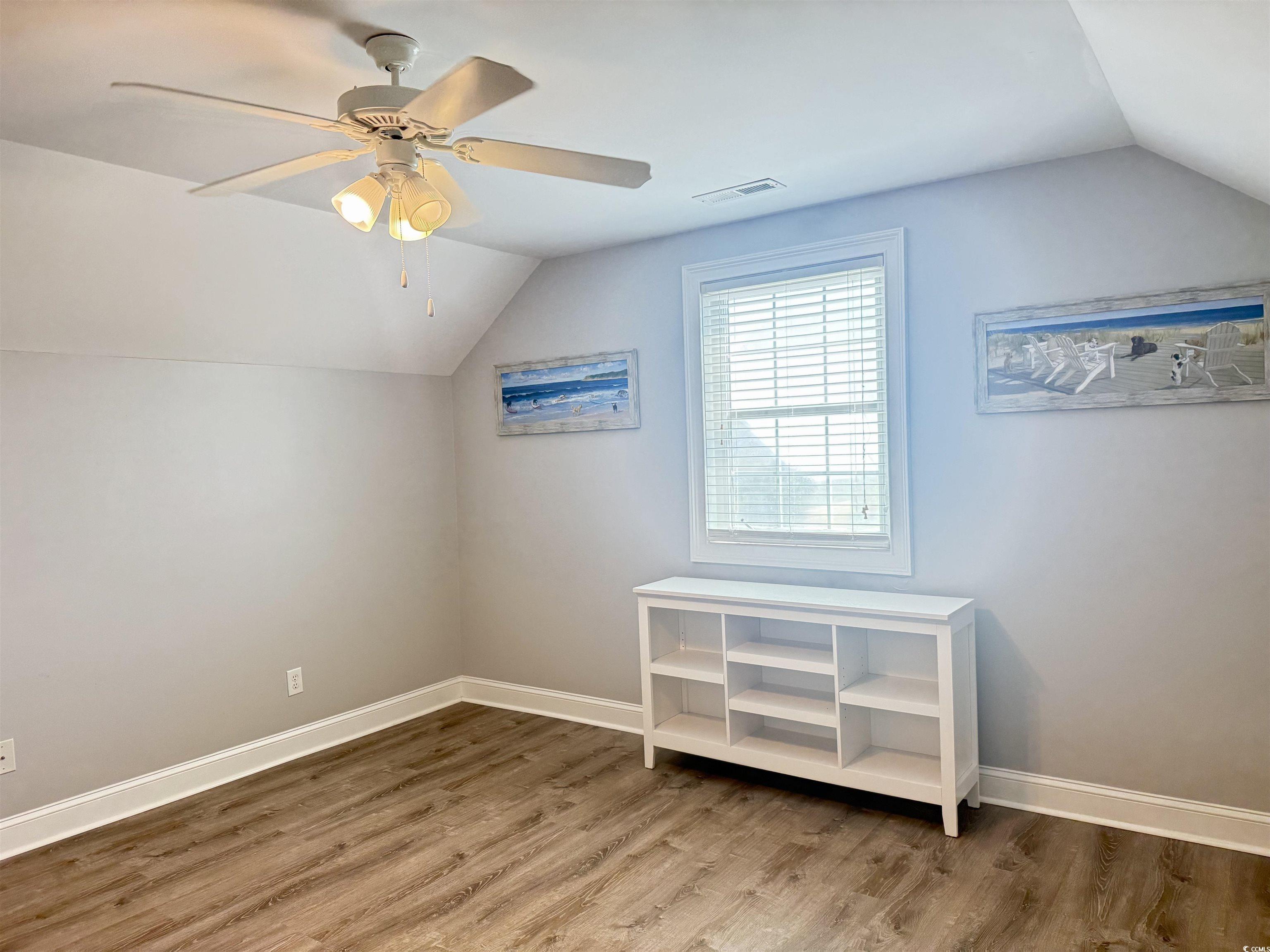 118 Georges Bay Road Murrells Inlet, SC 29576 - Photo 17 of 39 Additional living space with vaulted ceiling, light wood-style flooring, and a ceiling fan