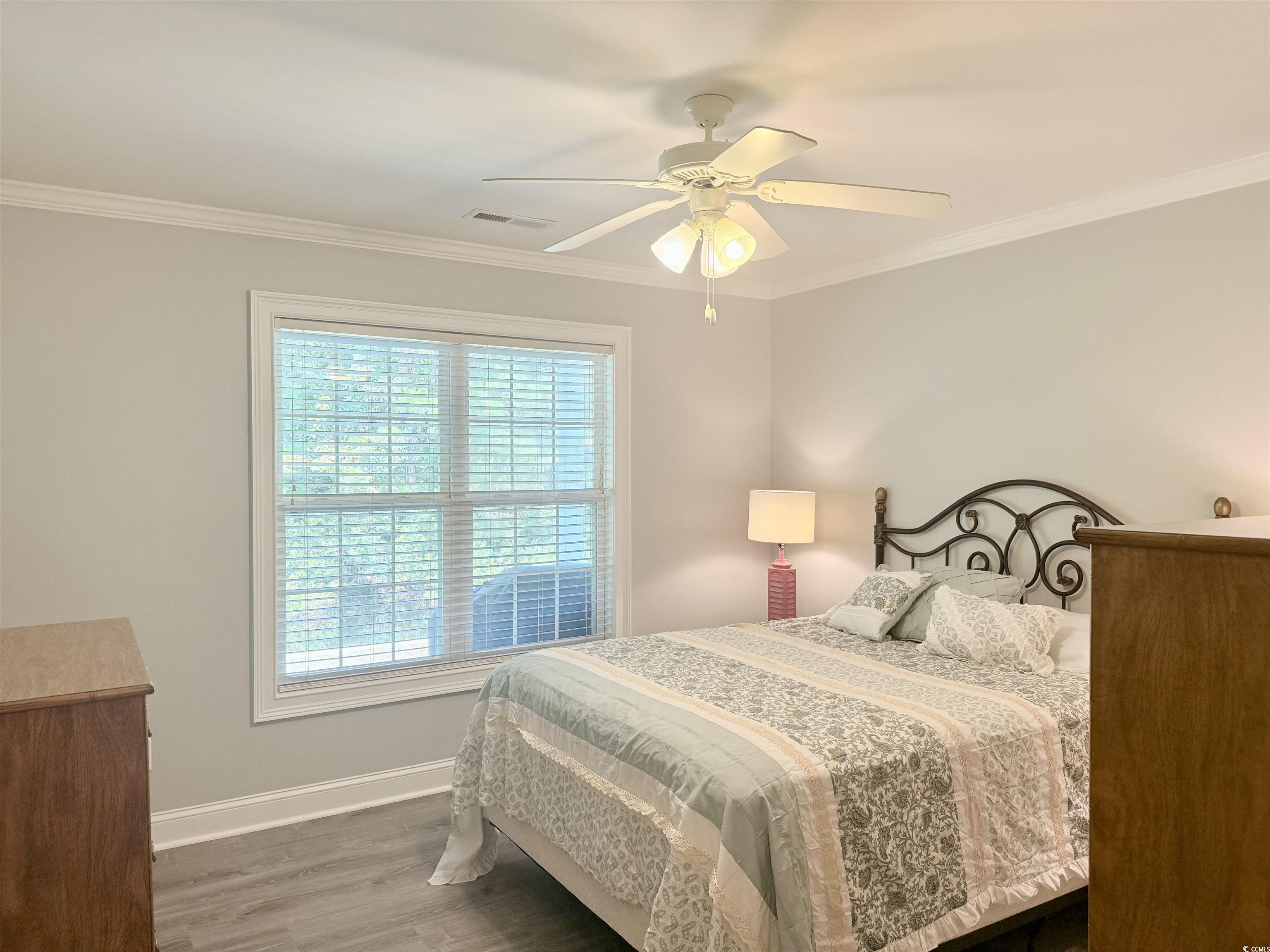 118 Georges Bay Road Murrells Inlet, SC 29576 - Photo 24 of 39 Bedroom featuring wood finished floors, ornamental molding, and ceiling fan