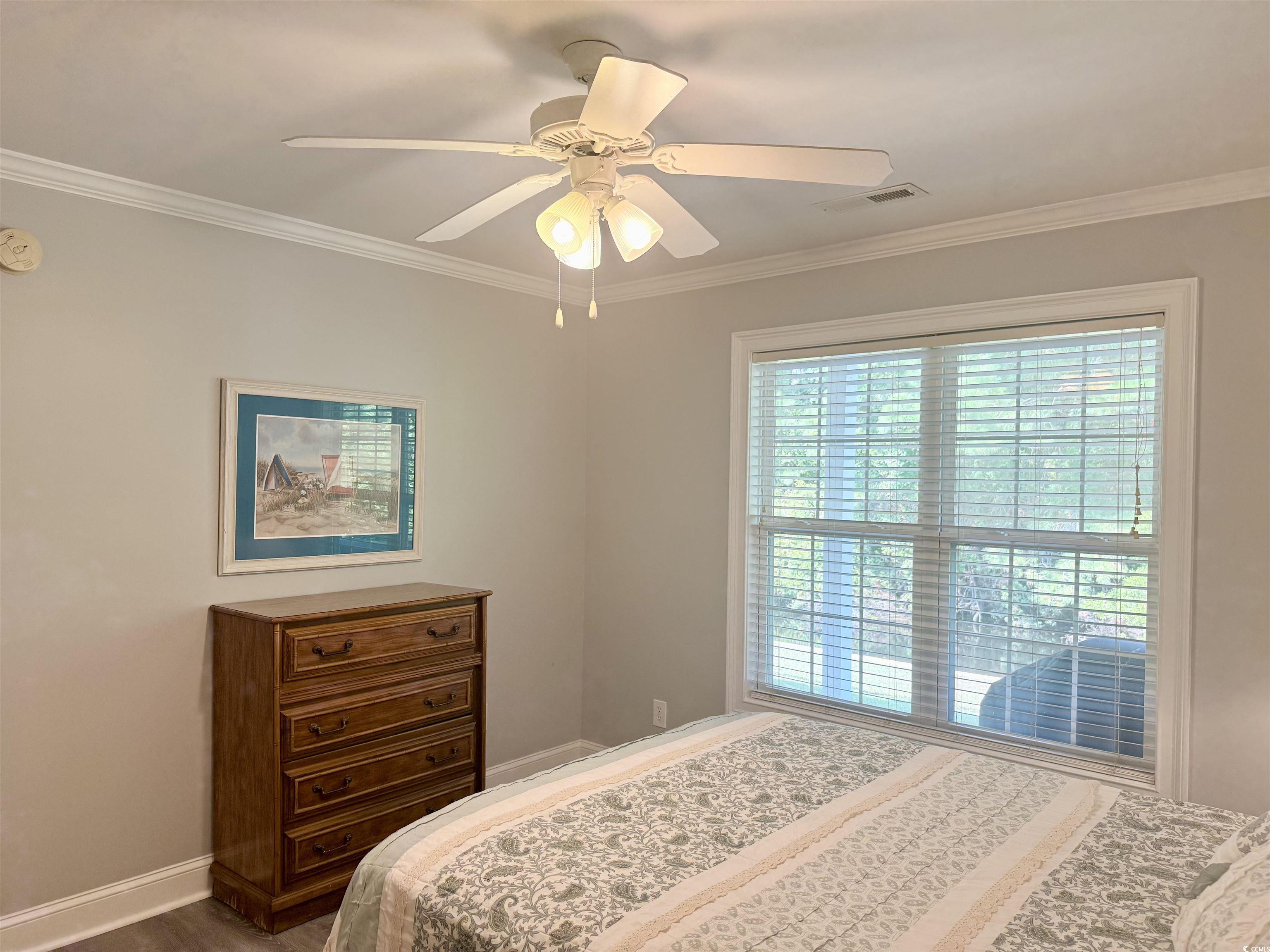 118 Georges Bay Road Murrells Inlet, SC 29576 - Photo 25 of 39 Bedroom with crown molding, ceiling fan, and wood finished floors