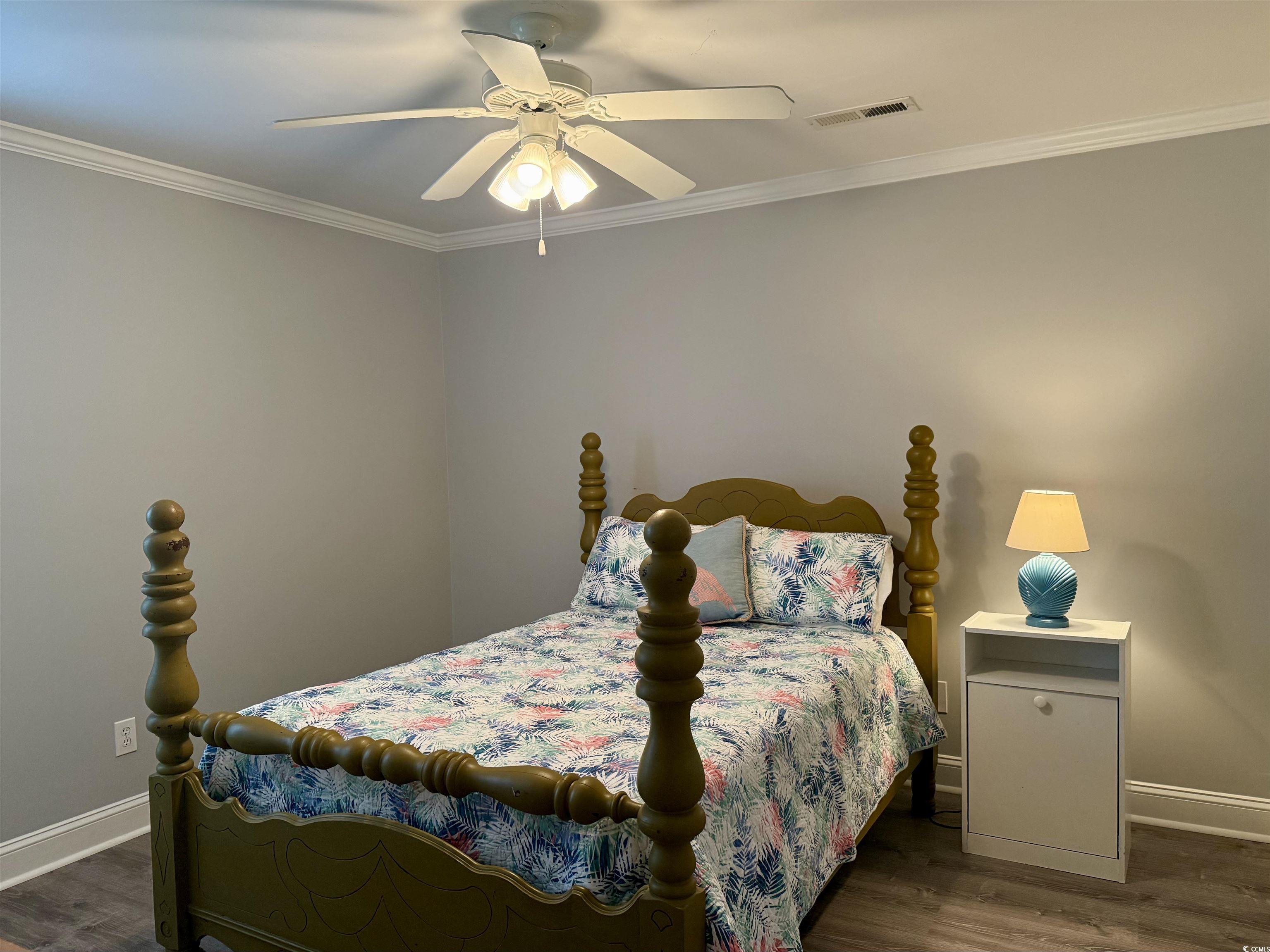 118 Georges Bay Road Murrells Inlet, SC 29576 - Photo 28 of 39 Bedroom featuring dark wood-type flooring, crown molding, and ceiling fan