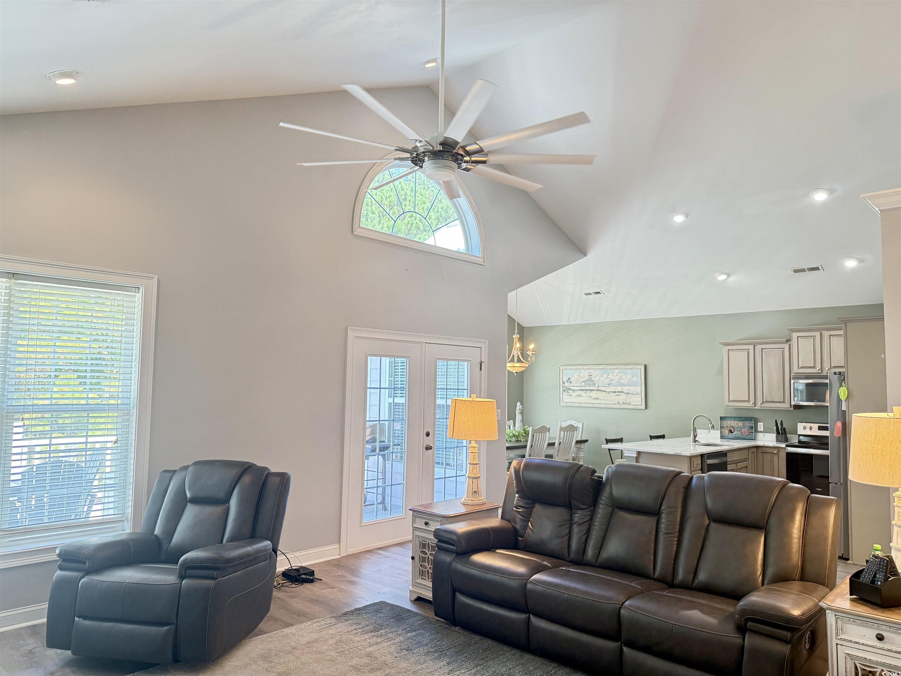 118 Georges Bay Road Murrells Inlet, SC 29576 - Photo 9 of 39 Living room featuring high vaulted ceiling, wood finished floors, ceiling fan, recessed lighting, and french doors