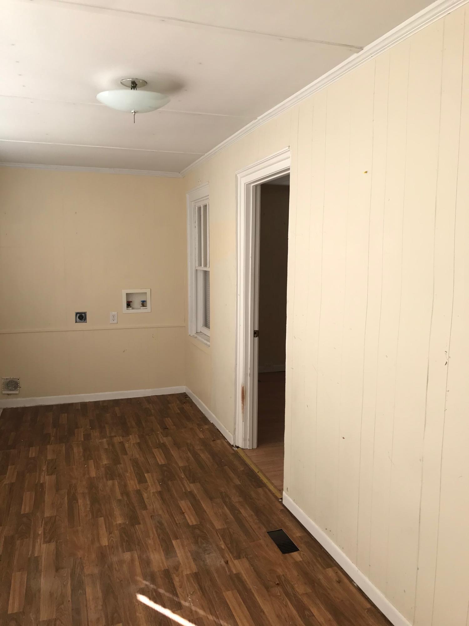 2553 Webster Road Roanoke, VA 24012 - Photo 11 of 29 a view of an empty room with wooden floor and a window