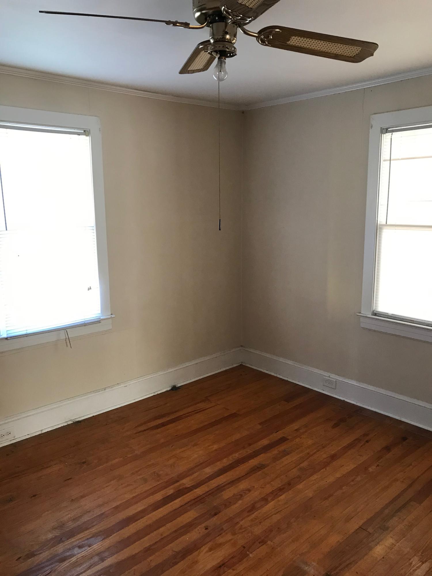 2553 Webster Road Roanoke, VA 24012 - Photo 15 of 29 an empty room with wooden floor and windows