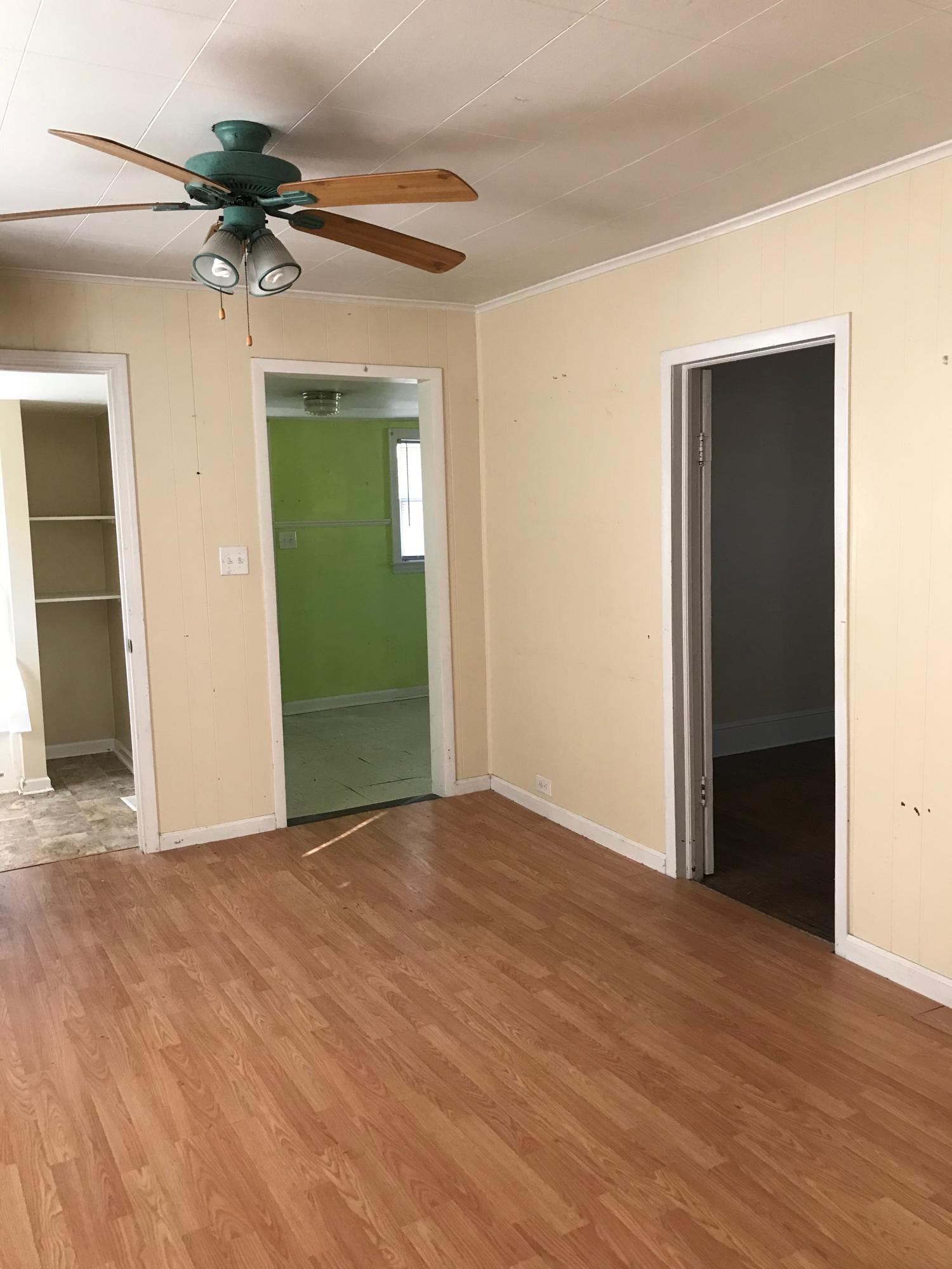 2553 Webster Road Roanoke, VA 24012 - Photo 17 of 29 a view of a big room with closet and a chandelier fan