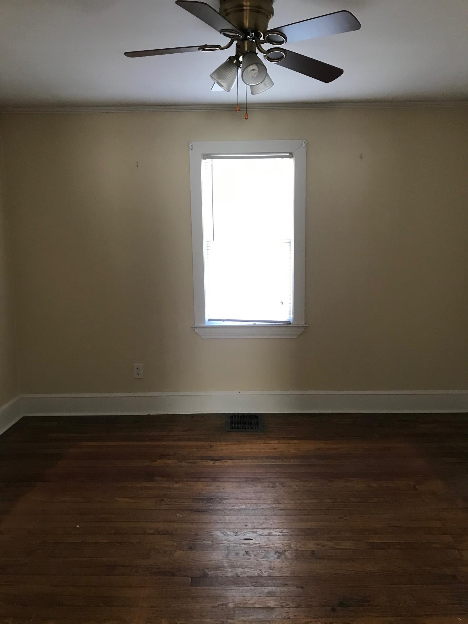 2553 Webster Road Roanoke, VA 24012 - Photo 18 of 29 an empty room with wooden floor fan and windows