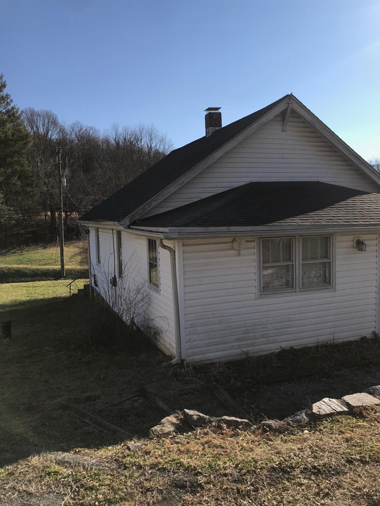2553 Webster Road Roanoke, VA 24012 - Photo 23 of 29 a front view of a house with a yard