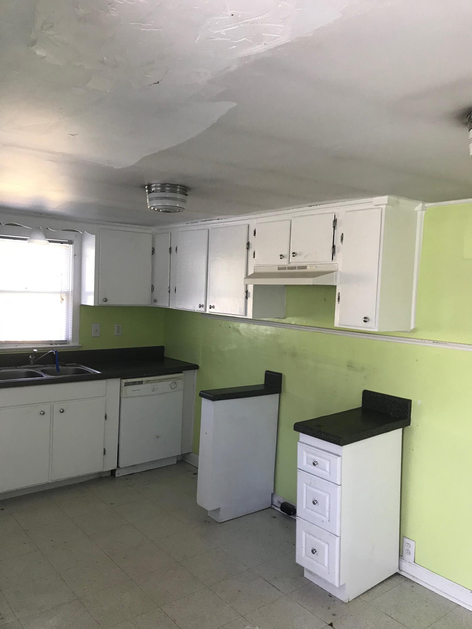 2553 Webster Road Roanoke, VA 24012 - Photo 4 of 29 a kitchen with cabinets and white appliances
