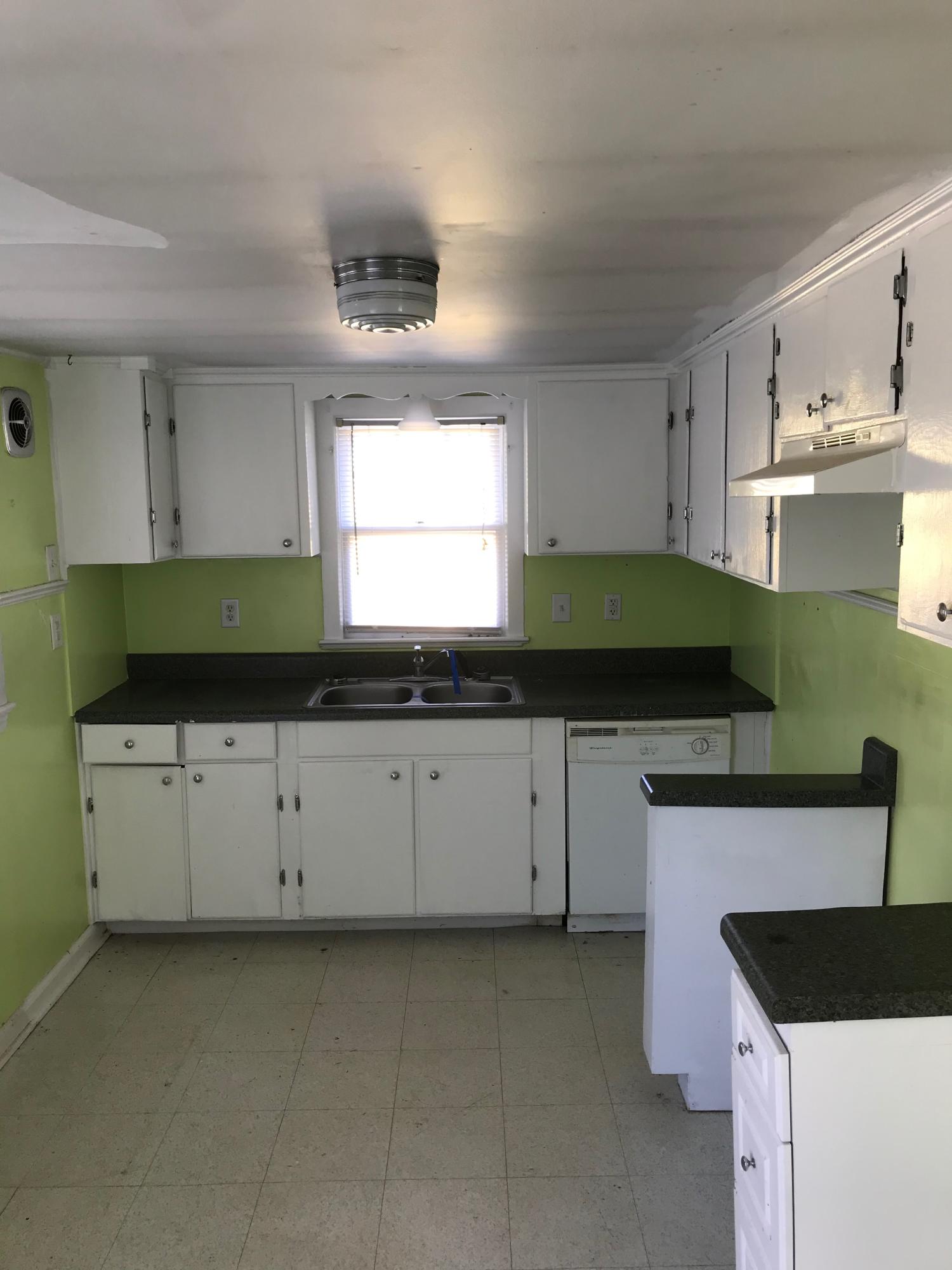 2553 Webster Road Roanoke, VA 24012 - Photo 5 of 29 a kitchen with granite countertop white cabinets and a sink