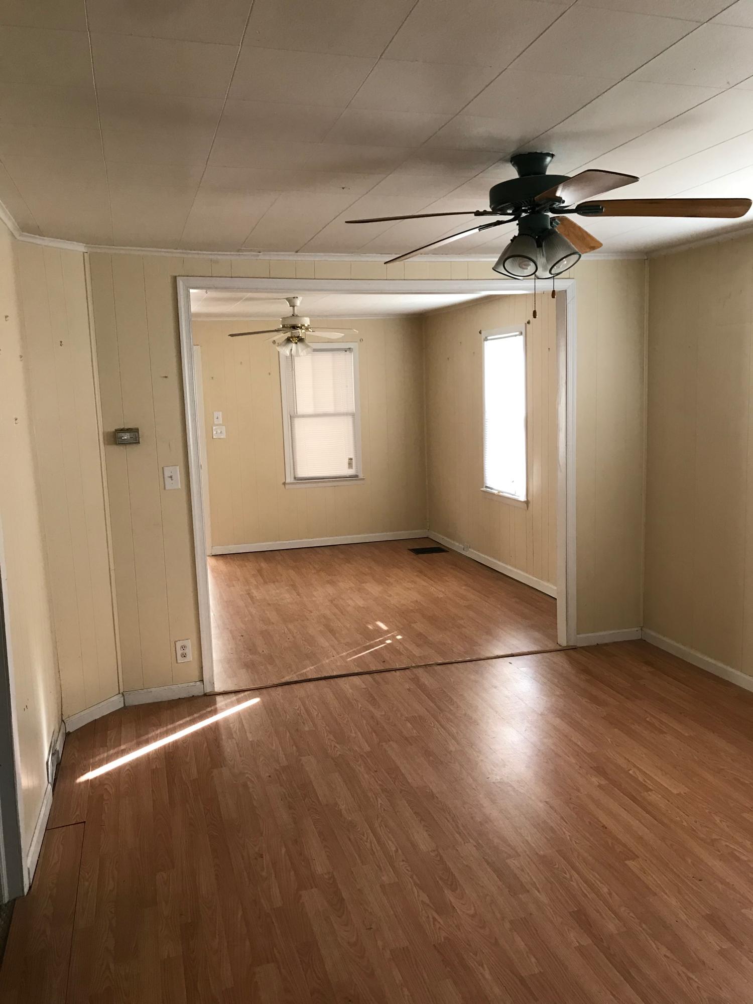2553 Webster Road Roanoke, VA 24012 - Photo 6 of 29 an empty room with wooden floor fan and windows