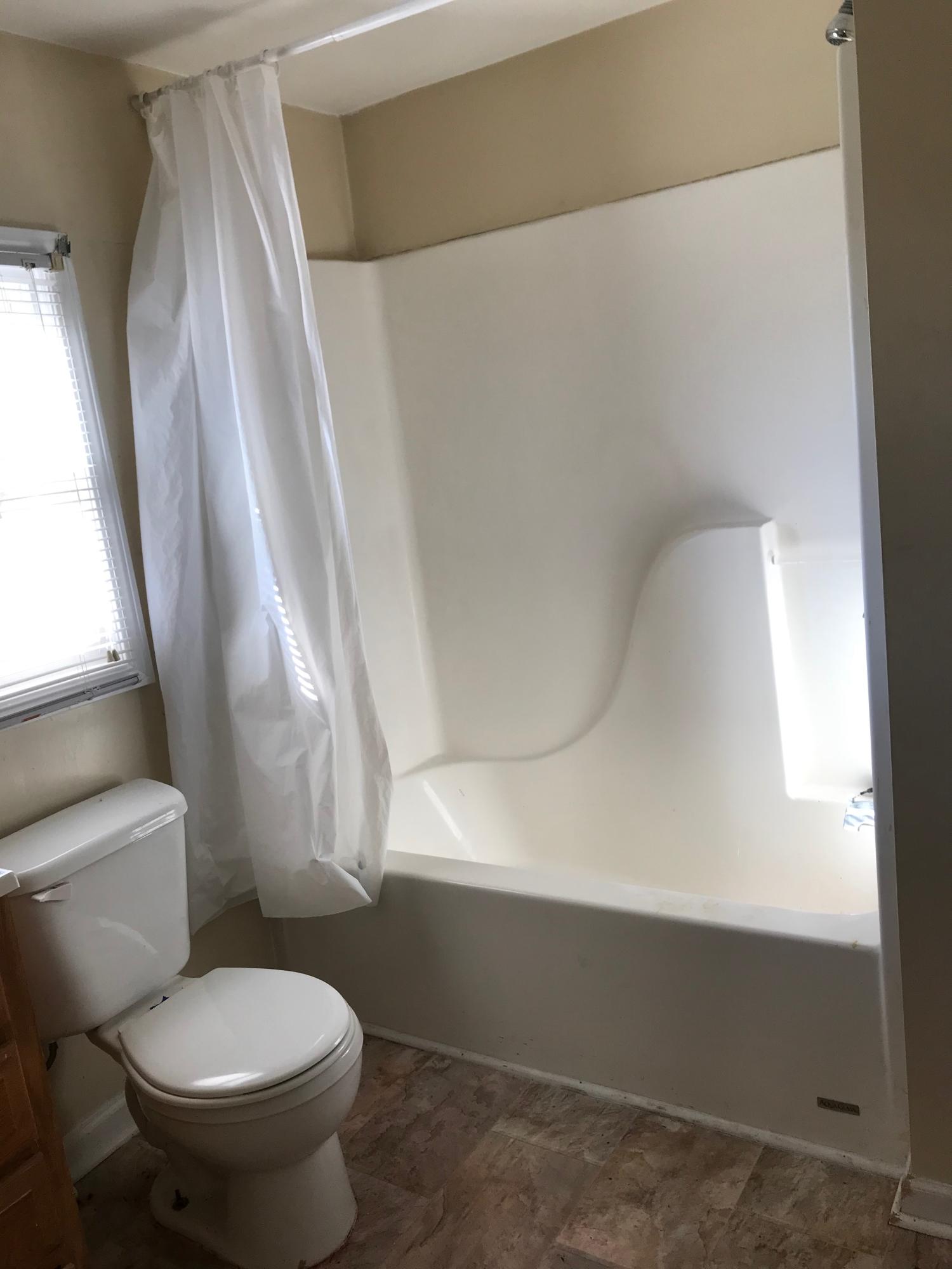 2553 Webster Road Roanoke, VA 24012 - Photo 8 of 29 a white toilet sitting next to a window