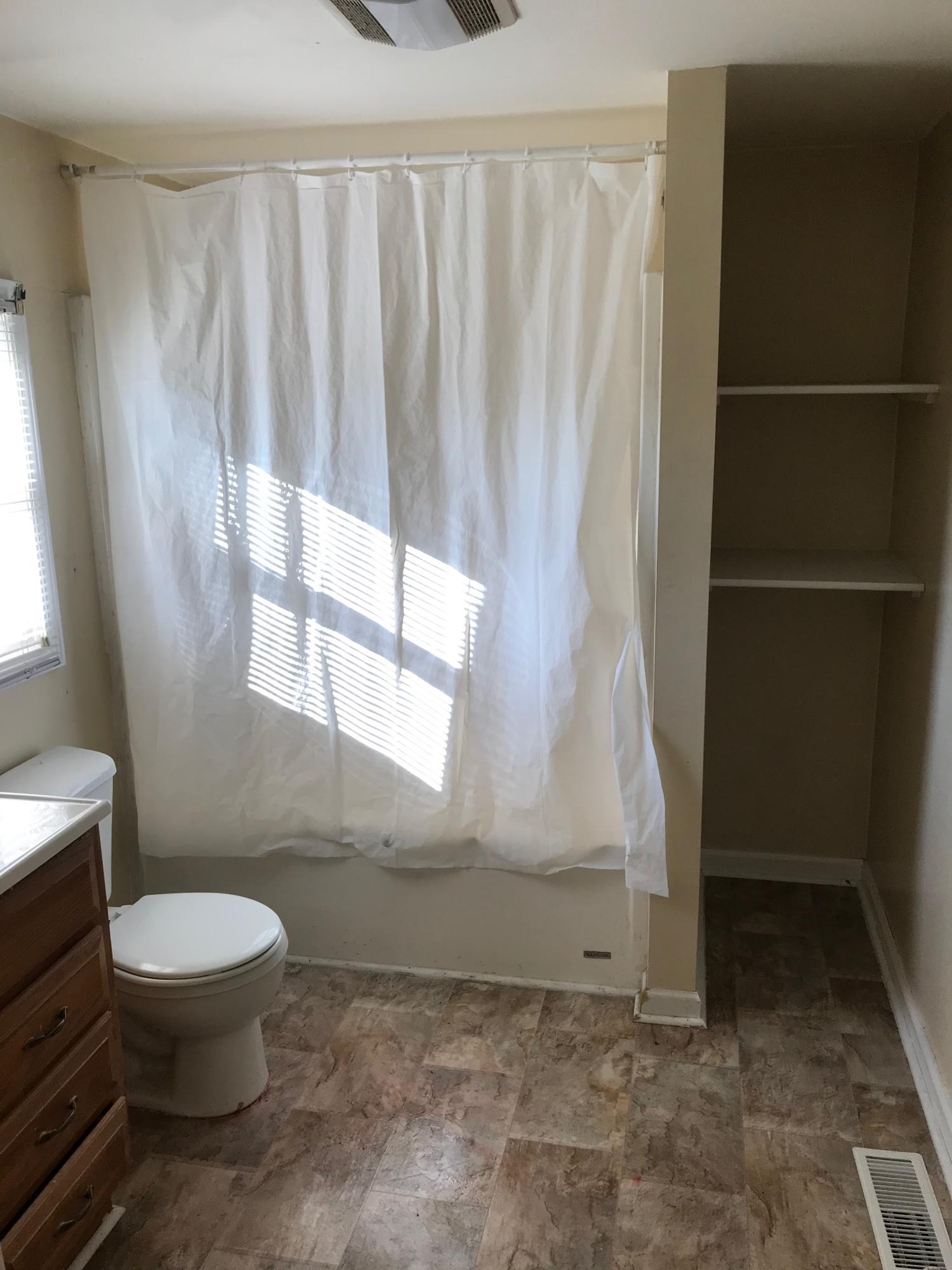 2553 Webster Road Roanoke, VA 24012 - Photo 9 of 29 a bathroom with a toilet and a shower