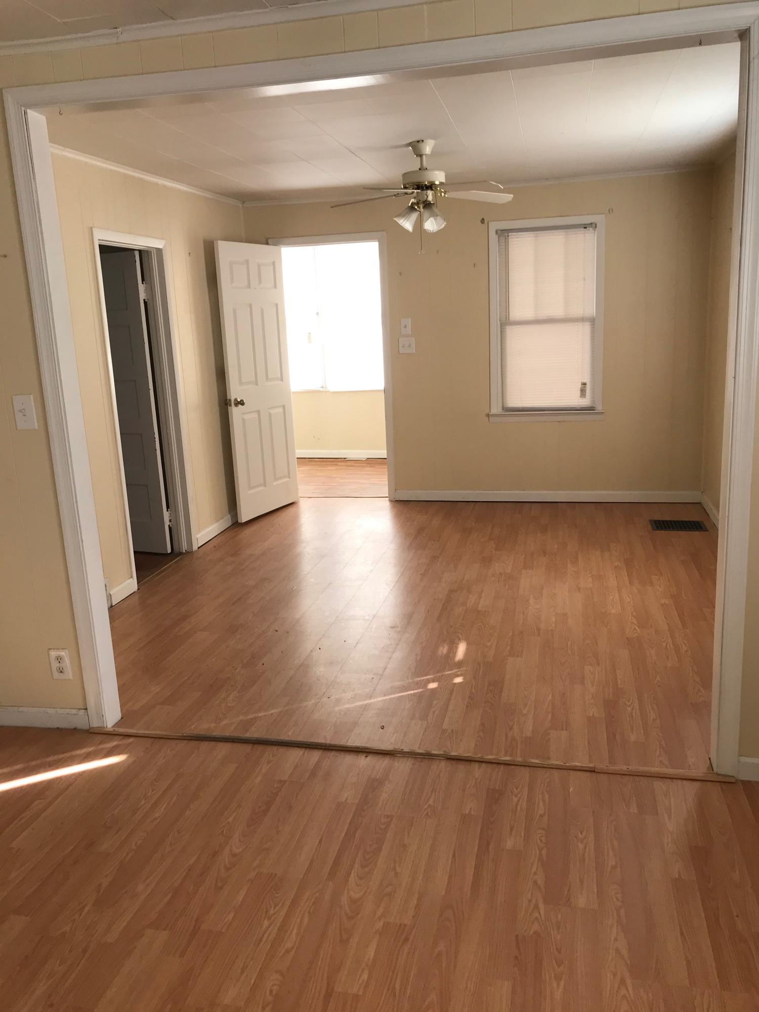 2553 Webster Road Roanoke, VA 24012 - Photo 10 of 29 an empty room with wooden floor and windows