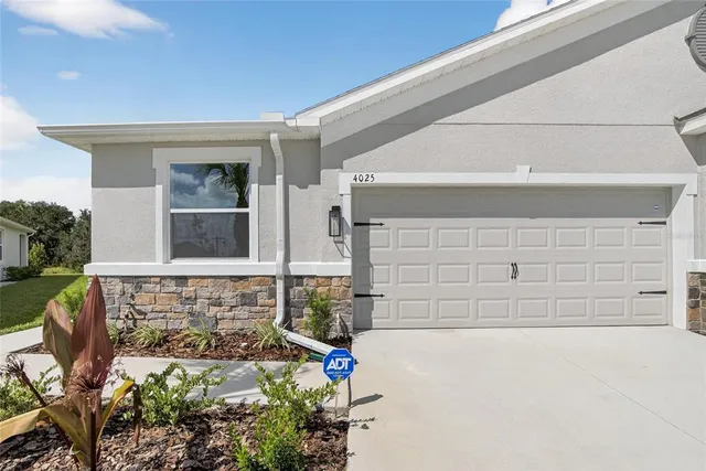 a house view with a sitting space and garden space