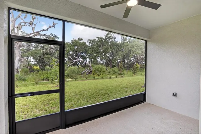 an aerial view of a house with a garden and swimming pool