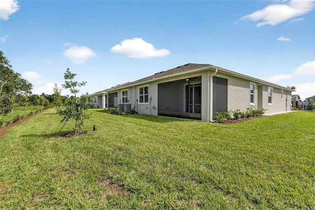 a view of a patio with a table and chairs