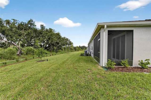 a view of sign board with flower around