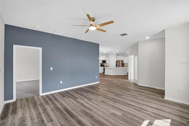 a kitchen with stainless steel appliances a sink stove and refrigerator