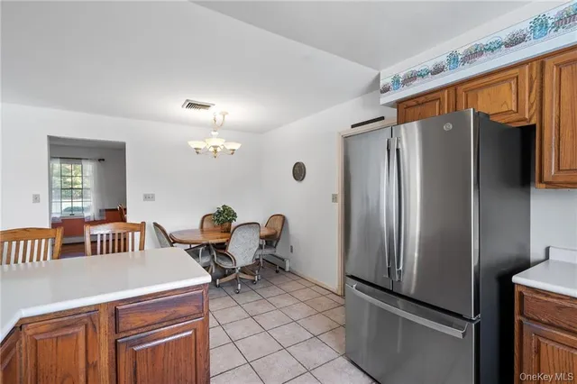 a kitchen with stainless steel appliances a refrigerator and a stove