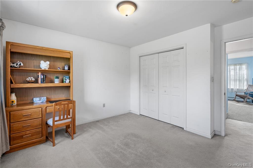 295 Borden Road Wallkill, NY 12589 - Photo 16 of 35 a room with a desk and chair