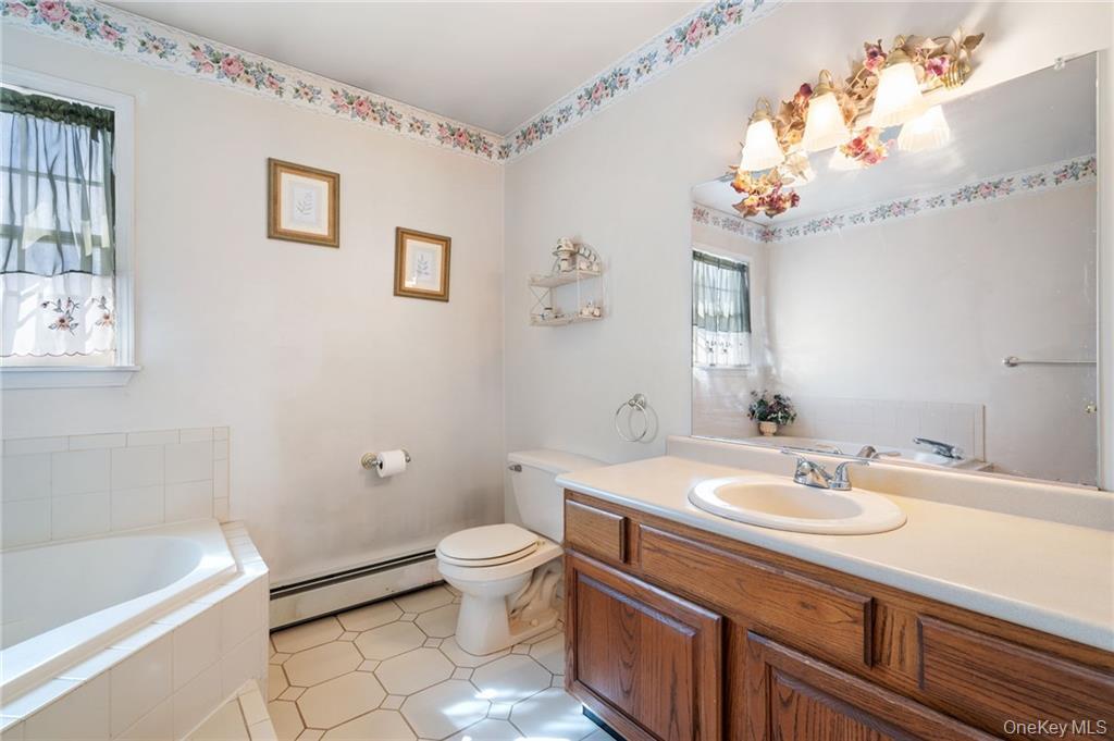 295 Borden Road Wallkill, NY 12589 - Photo 22 of 35 a bathroom with a sink a toilet and bathtub