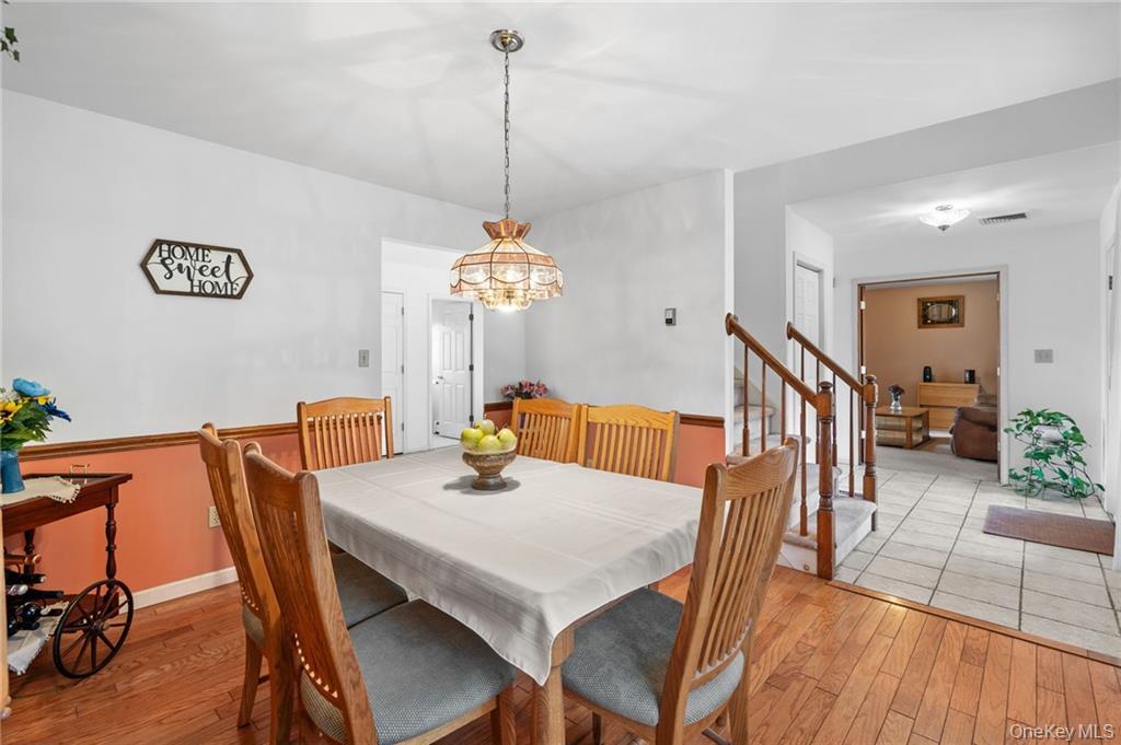 295 Borden Road Wallkill, NY 12589 - Photo 5 of 35 a view of a dining room with furniture wooden floor and chandelier
