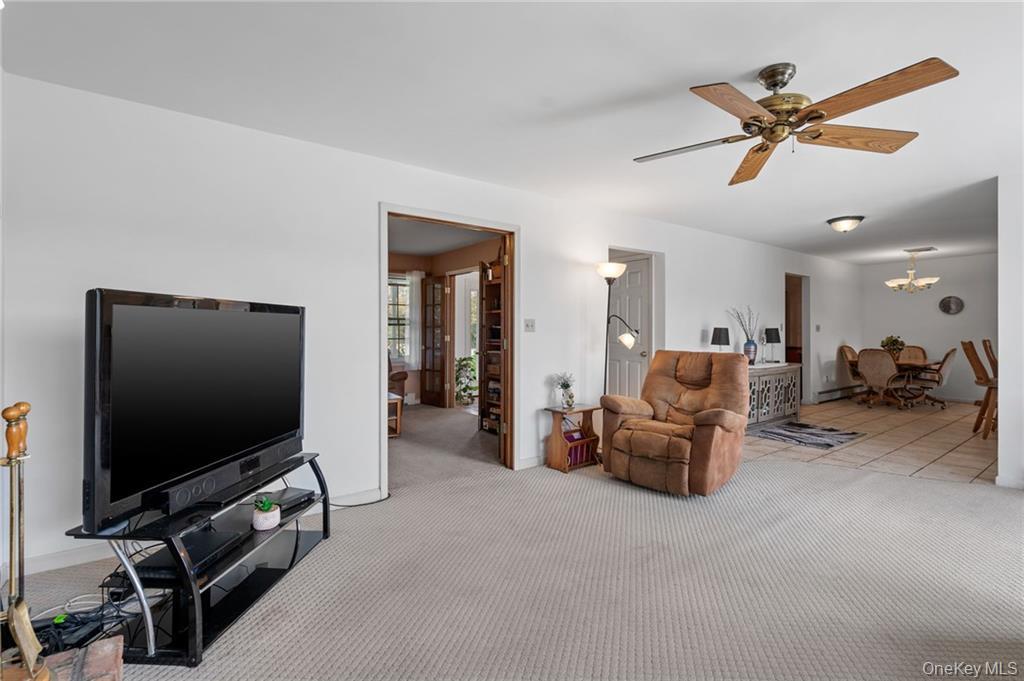 295 Borden Road Wallkill, NY 12589 - Photo 8 of 35 a living room with furniture and a flat screen tv
